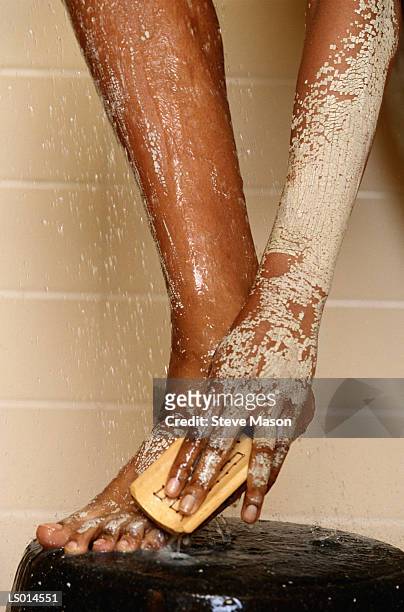 woman washing off a body wrap - peeling off bildbanksfoton och bilder