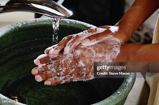 washing hands at the spa - washing hands close up stock pictures, royalty-free photos & images