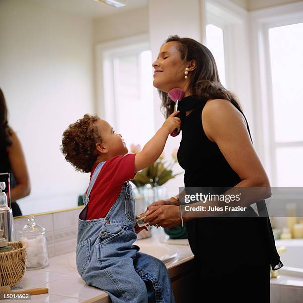 mother and son playing with makeup - pincel de blush imagens e fotografias de stock