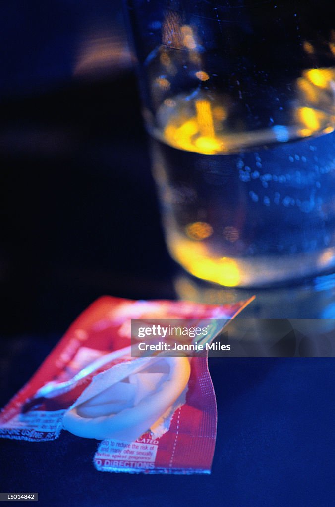 Condom on Bedside Table