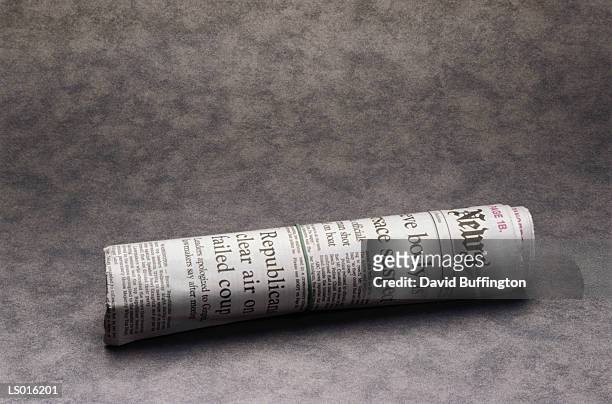 rolled up newspaper - rolled newspaper stock pictures, royalty-free photos & images