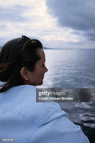 woman gazing at water - north pacific ocean stock pictures, royalty-free photos & images