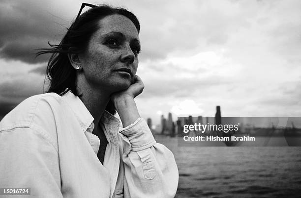 woman with city in background - north pacific ocean stock pictures, royalty-free photos & images