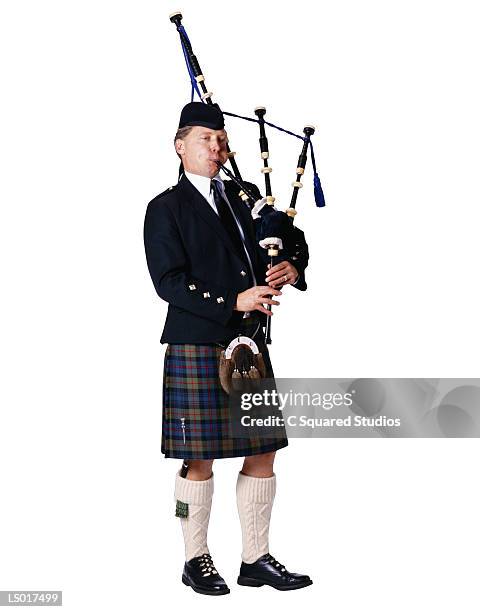 great highlander bagpiper - bagpipe stock pictures, royalty-free photos & images