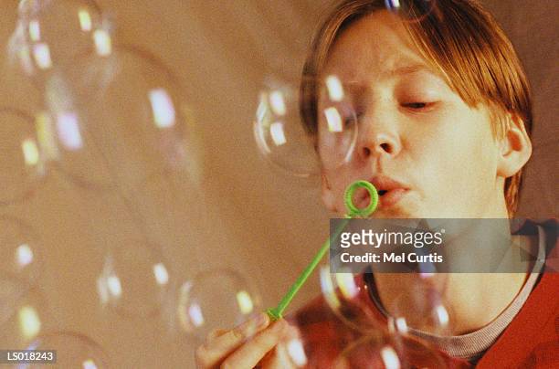 blowing bubbles - curtis stock pictures, royalty-free photos & images