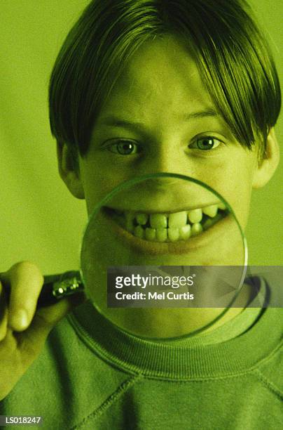 smile in magnifying glass - curtis stock pictures, royalty-free photos & images
