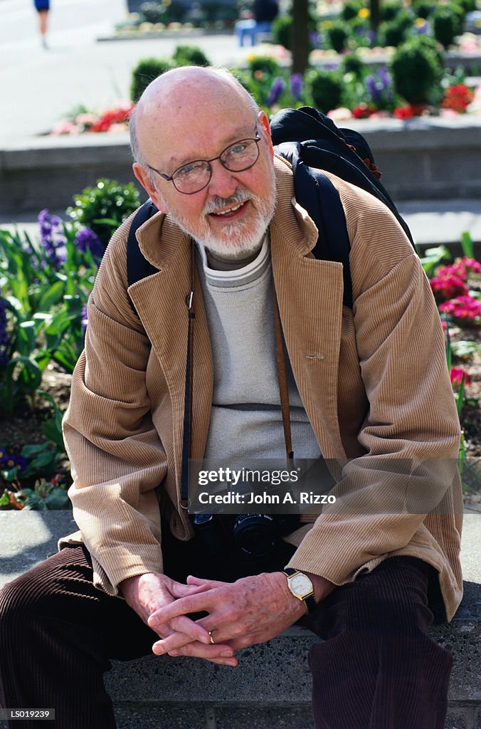 Seated Man with Camera