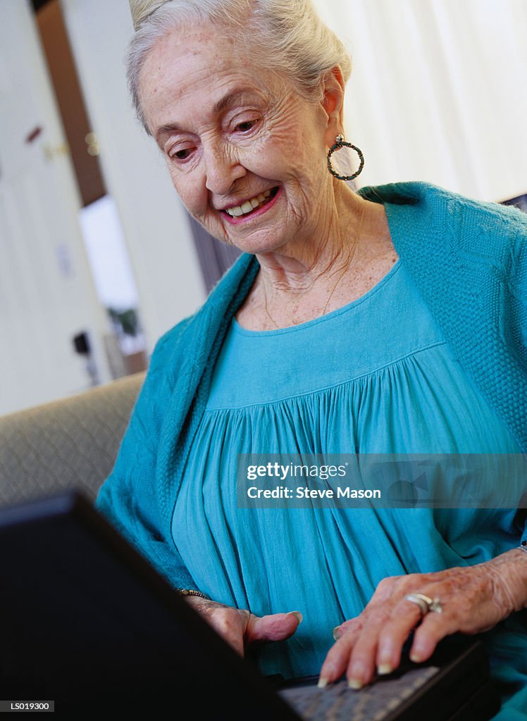 Woman Using Laptop
