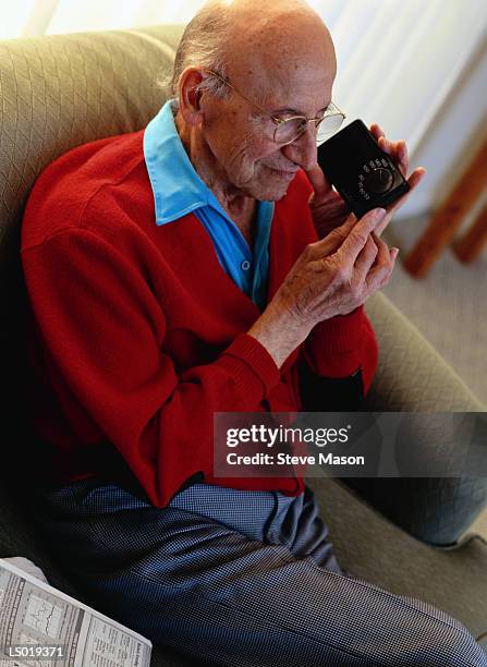 man listening to portable radio - portable radio stock pictures, royalty-free photos & images