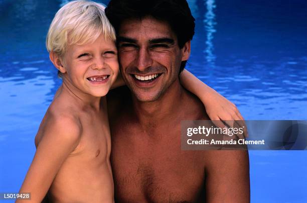 man and boy at swimming pool - amanda and amanda fotografías e imágenes de stock