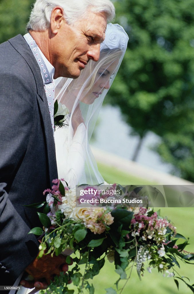Father Walking the Bride Down the Aisle