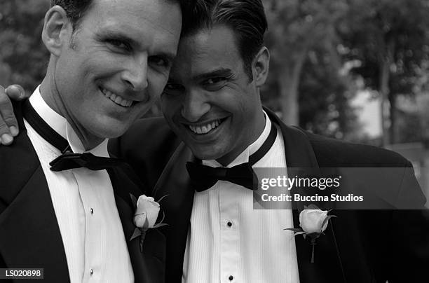 gay couple at their commitment ceremony - marriage equality stock pictures, royalty-free photos & images