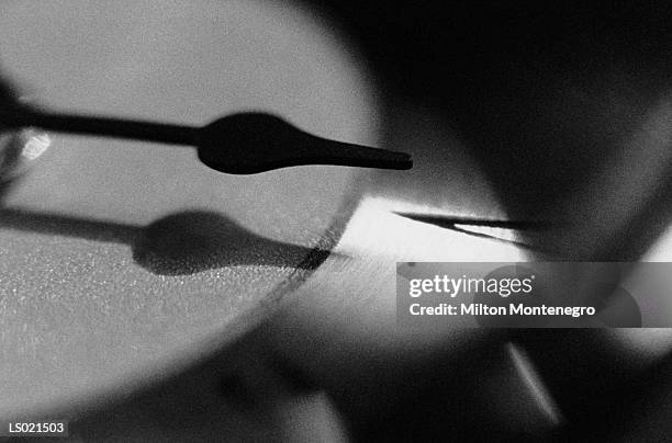 close-up of the hour hand on a clock - ancine stockfoto's en -beelden