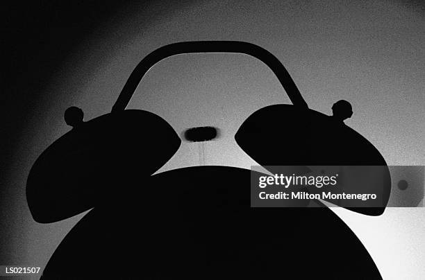 silhouette of an alarm clock ringing - ancine stock pictures, royalty-free photos & images