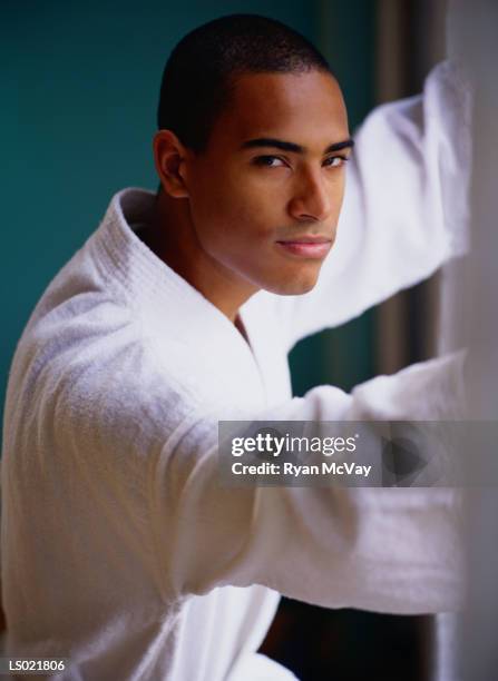 portrait of a serious man in a bathrobe - a serious man stock pictures, royalty-free photos & images