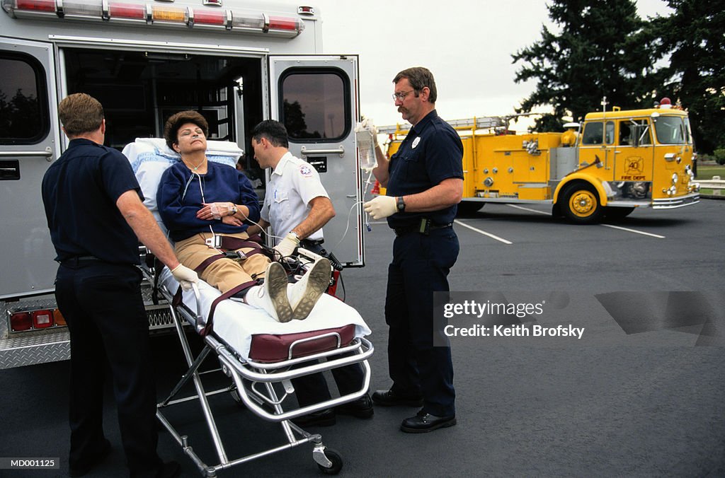 Paramedics Putting Woman in Ambulance