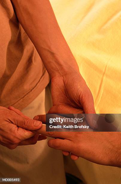 hand massage - hand massage stock pictures, royalty-free photos & images