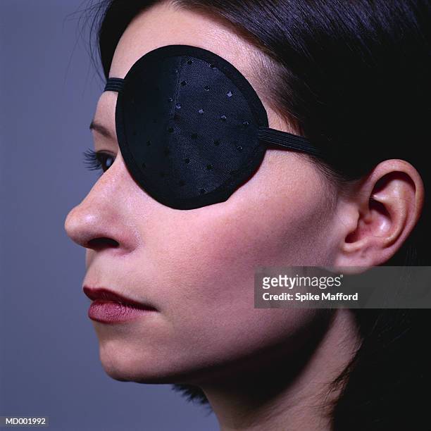 eye patch on woman - medical eye patch stockfoto's en -beelden