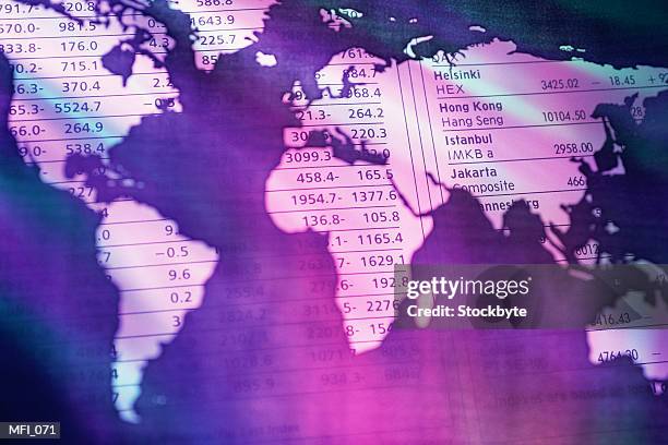world map stencil on top of stock market quotations - share prices of consumer companies pushes dow jones industrials average sharply higher stockfoto's en -beelden