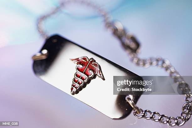 close-up of medical alert bracelet - hospital identification bracelet stock pictures, royalty-free photos & images