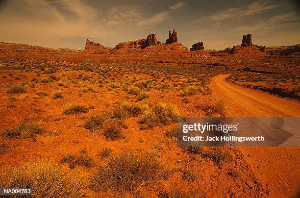 desert brush and dirt road - jack and jack stock pictures, royalty-free photos & images