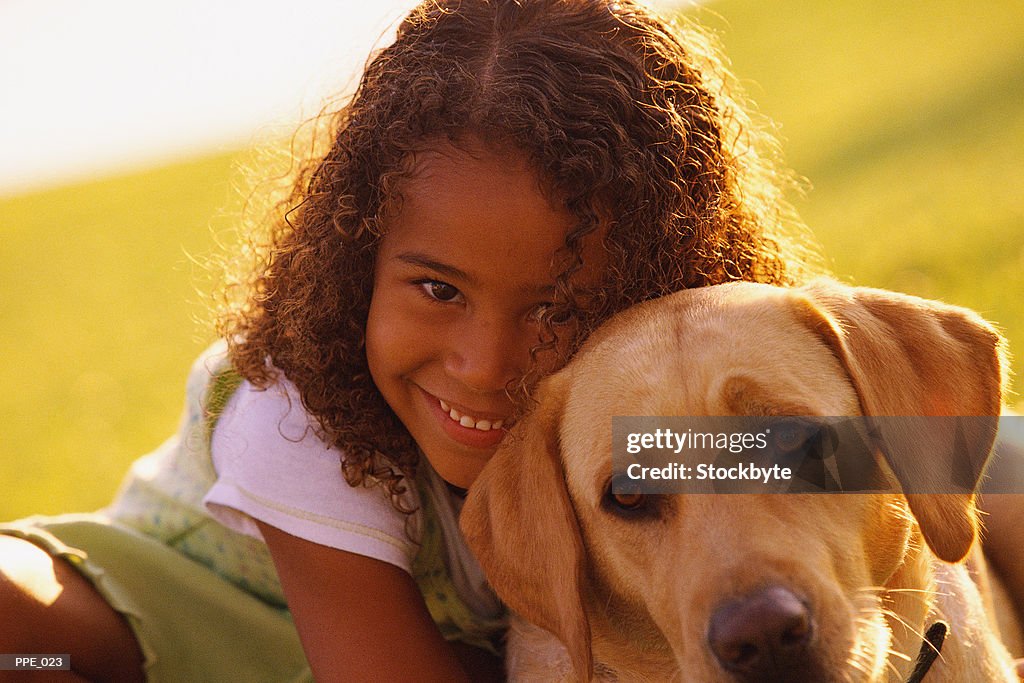 Girl hugging dog