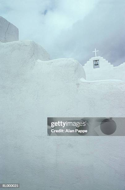 whitewashed church, exterior with bell, low angle view - bell fotografías e imágenes de stock