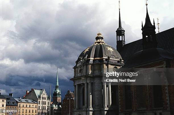 church spire and golden dome - stockholm county stock pictures, royalty-free photos & images