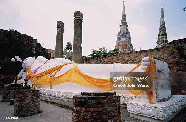 reclining buddha - reclining buddha statue stock pictures, royalty-free photos & images