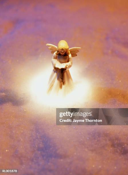 angel figurine in snow - thornton stock pictures, royalty-free photos & images