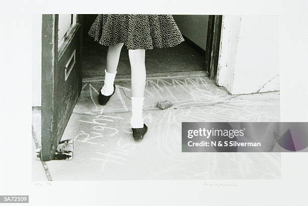 girl entering doorway - girl with legs open stock pictures, royalty-free photos & images