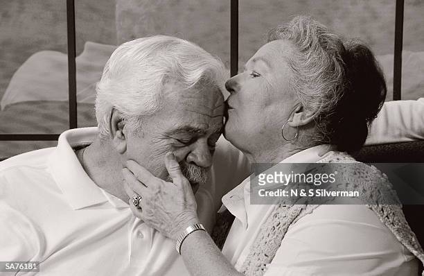 elderly couple / woman kissing man on the forehead - venezuelan foreign minister jorge arreaza addresses media at u n fotografías e imágenes de stock