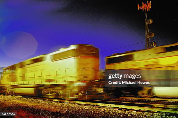 diesel engines passing, train yard, night (blurred motion) - train yard at night stock pictures, royalty-free photos & images
