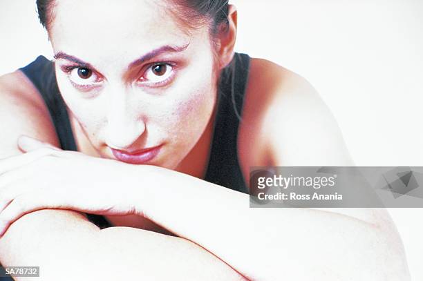 woman leaning on folded arms, portrait - ross stockfoto's en -beelden