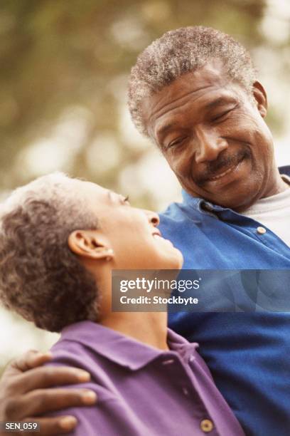 man and woman smiling at one another - aother stock pictures, royalty-free photos & images