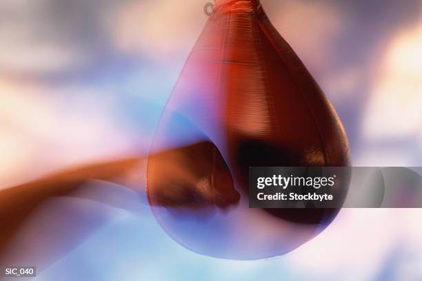 hand striking punching bag - punching ball stock pictures, royalty-free photos & images