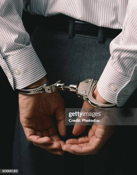 handcuffed businessman - so000183 stock-fotos und bilder