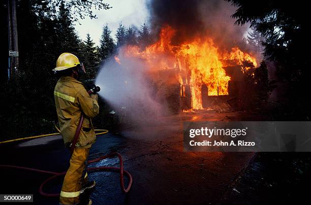 putting out house fire - in flames i the mask stock pictures, royalty-free photos & images