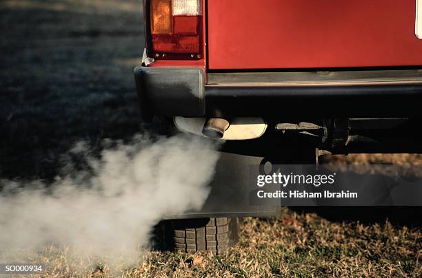 smoke coming from exhaust pipe of a car - car bumper stock pictures, royalty-free photos & images