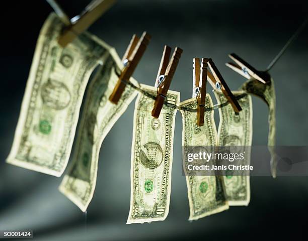 money laundering - money laundery stockfoto's en -beelden