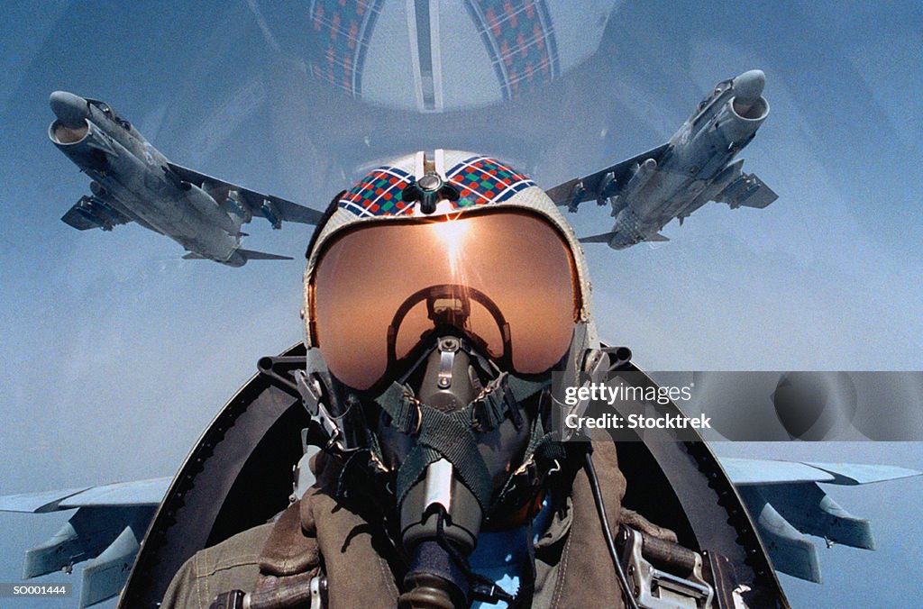 Jet aircraft pilot in cockpit, close-up