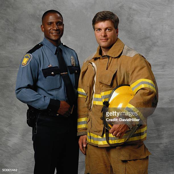police officer and firefighter - brandweeruniform stockfoto's en -beelden