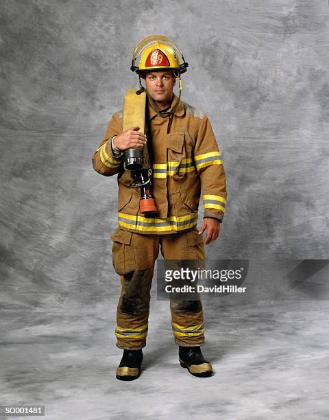 portrait of firefighter - brandweeruniform stockfoto's en -beelden