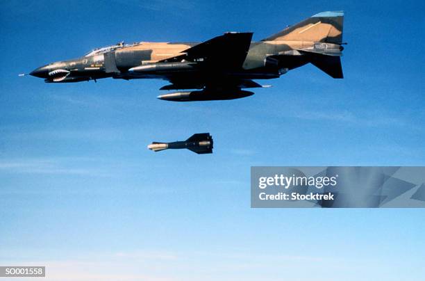 military aircraft dropping a bomb - bomb drops stock pictures, royalty-free photos & images