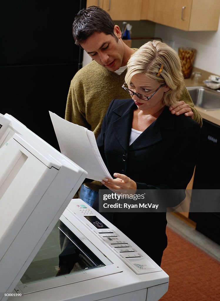 Man Touching a Businesswoman's Shoulder