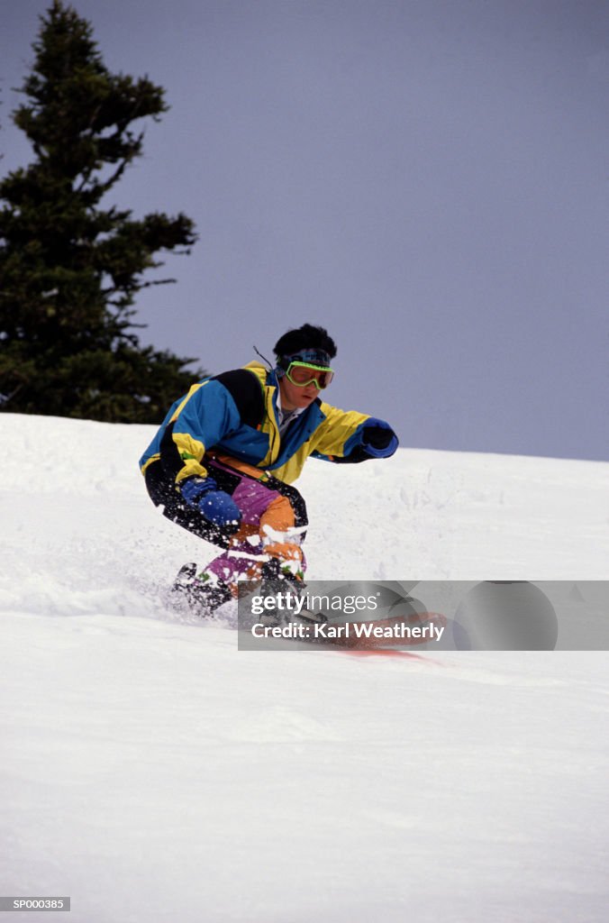 Woman Snowboarding