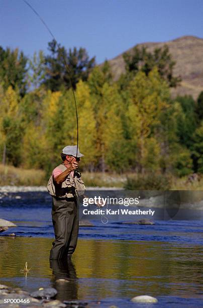 man in waders ready to cast - cast of amcs low winter sun q a with art house convergence stockfoto's en -beelden