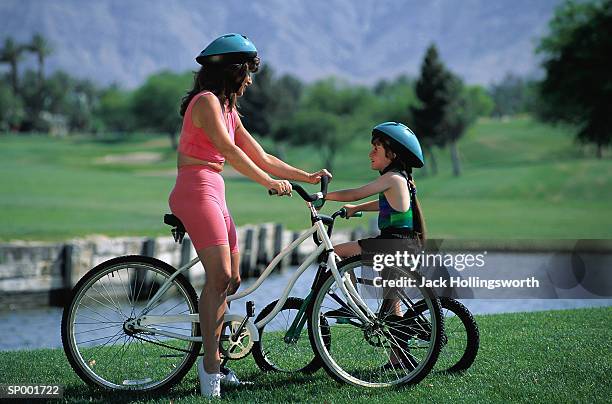 mother and daughter on bicycles - jack and jack stock pictures, royalty-free photos & images