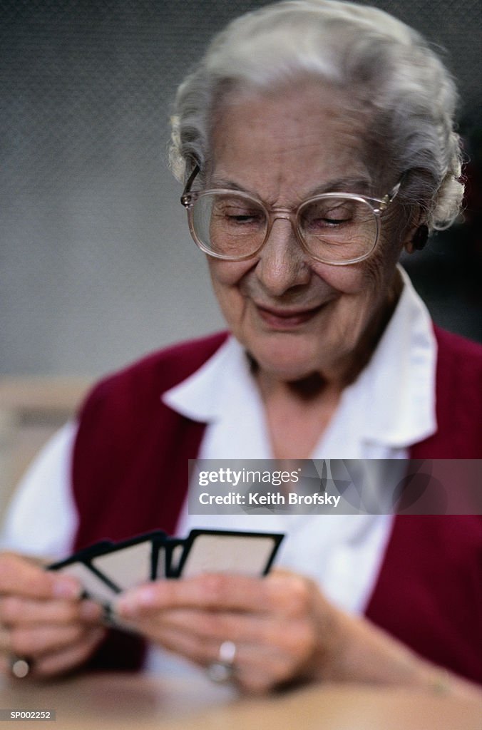 Elderly Woman Playing Cards