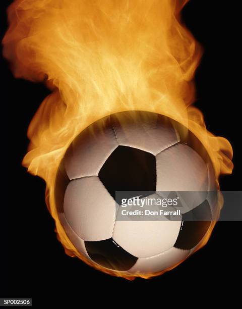 burning soccer ball - don farrall stock pictures, royalty-free photos & images